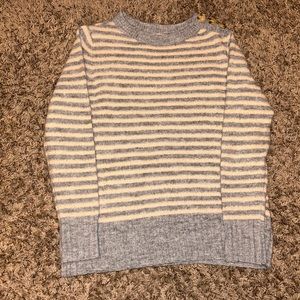 Striped grey and pink sweater with buttons on the left side